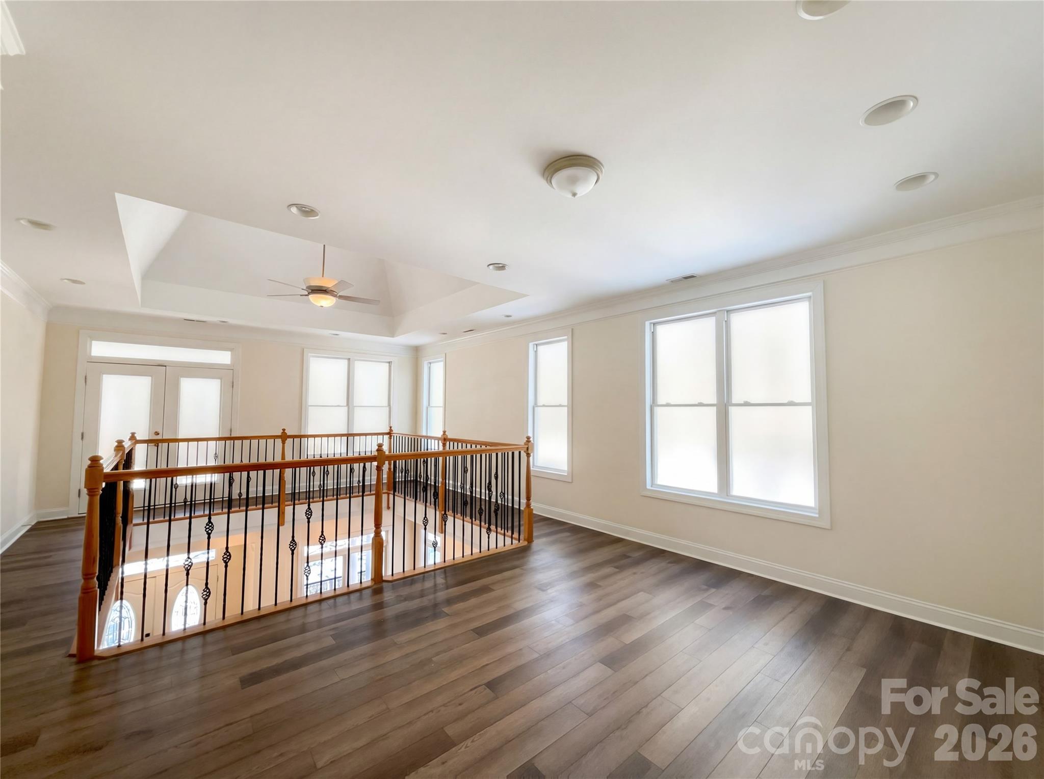 405 Isle Of Pines Road Mooresville, NC 28117 - Photo 14 of 18 a view of an empty room with wooden floor and a window