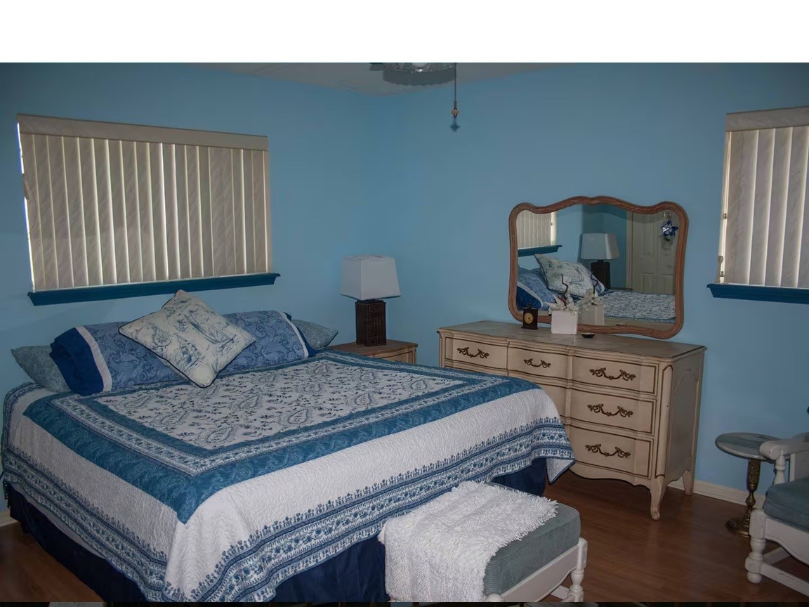 460 616th Sargent, TX 77414 - Photo 11 of 23 a bedroom with a bed and dresser