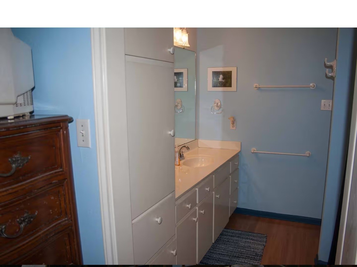460 616th Sargent, TX 77414 - Photo 12 of 23 a bathroom with a sink and mirror