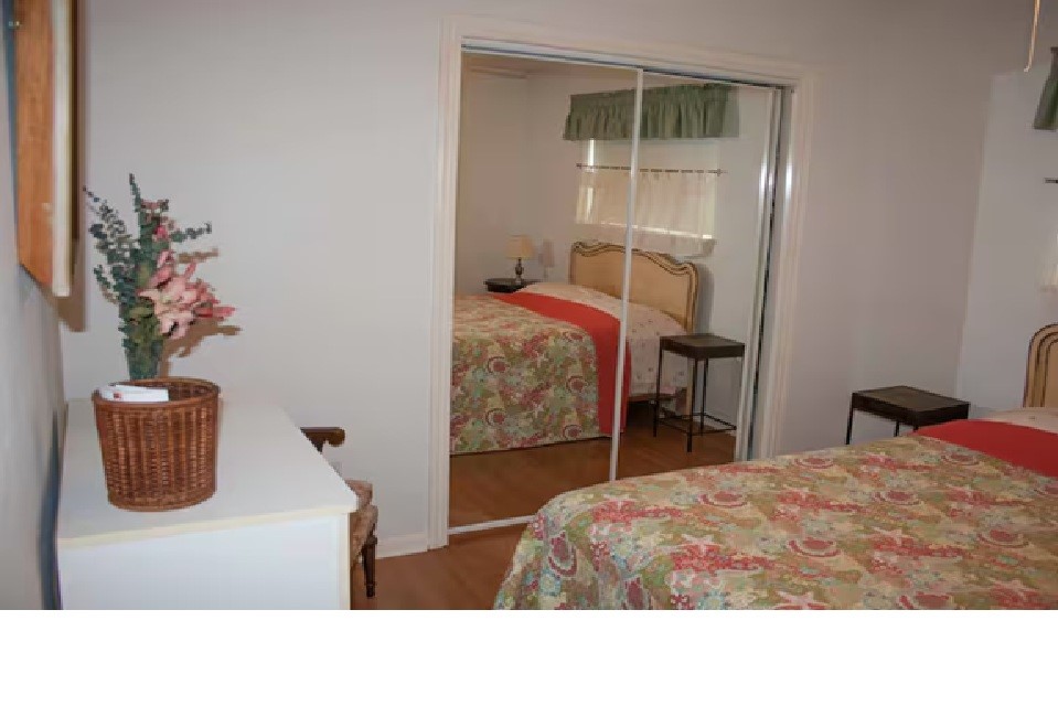 460 616th Sargent, TX 77414 - Photo 14 of 23 a bedroom with a bed and a chair