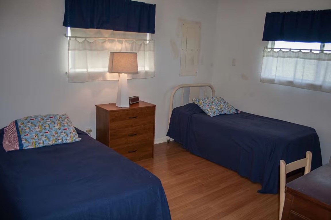 460 616th Sargent, TX 77414 - Photo 15 of 23 a bedroom with a bed and a window
