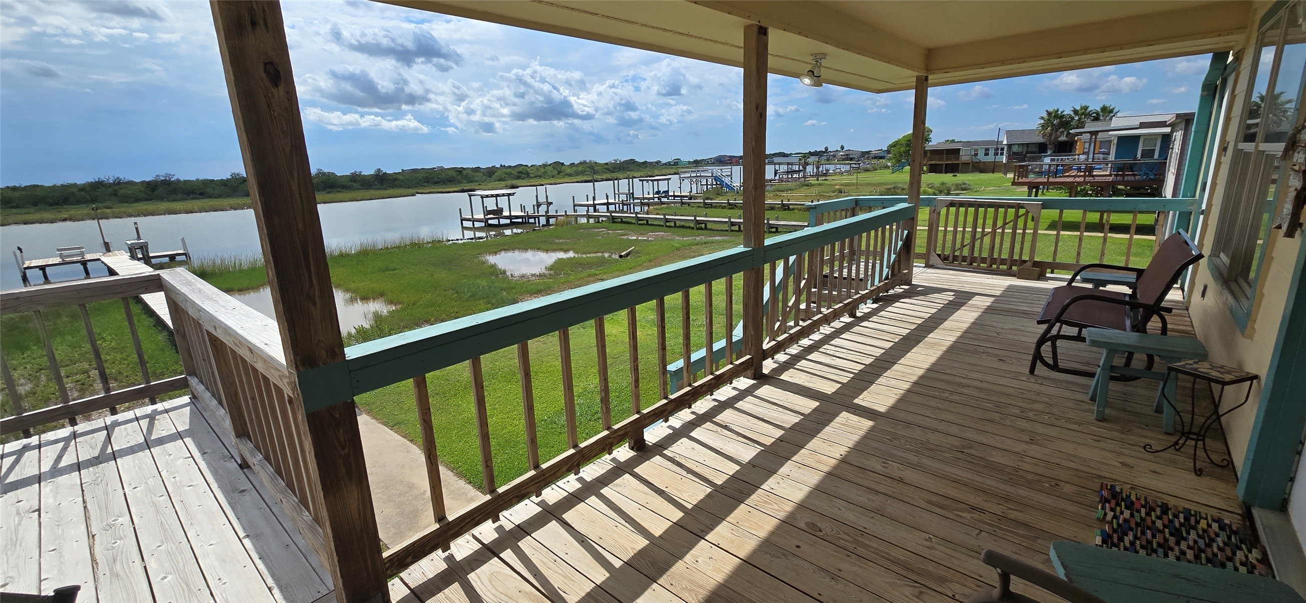 460 616th Sargent, TX 77414 - Photo 17 of 23 a view of balcony with wooden floor and outdoor seating