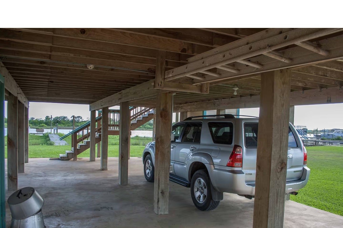 460 616th Sargent, TX 77414 - Photo 22 of 23 a view of car parked in garage