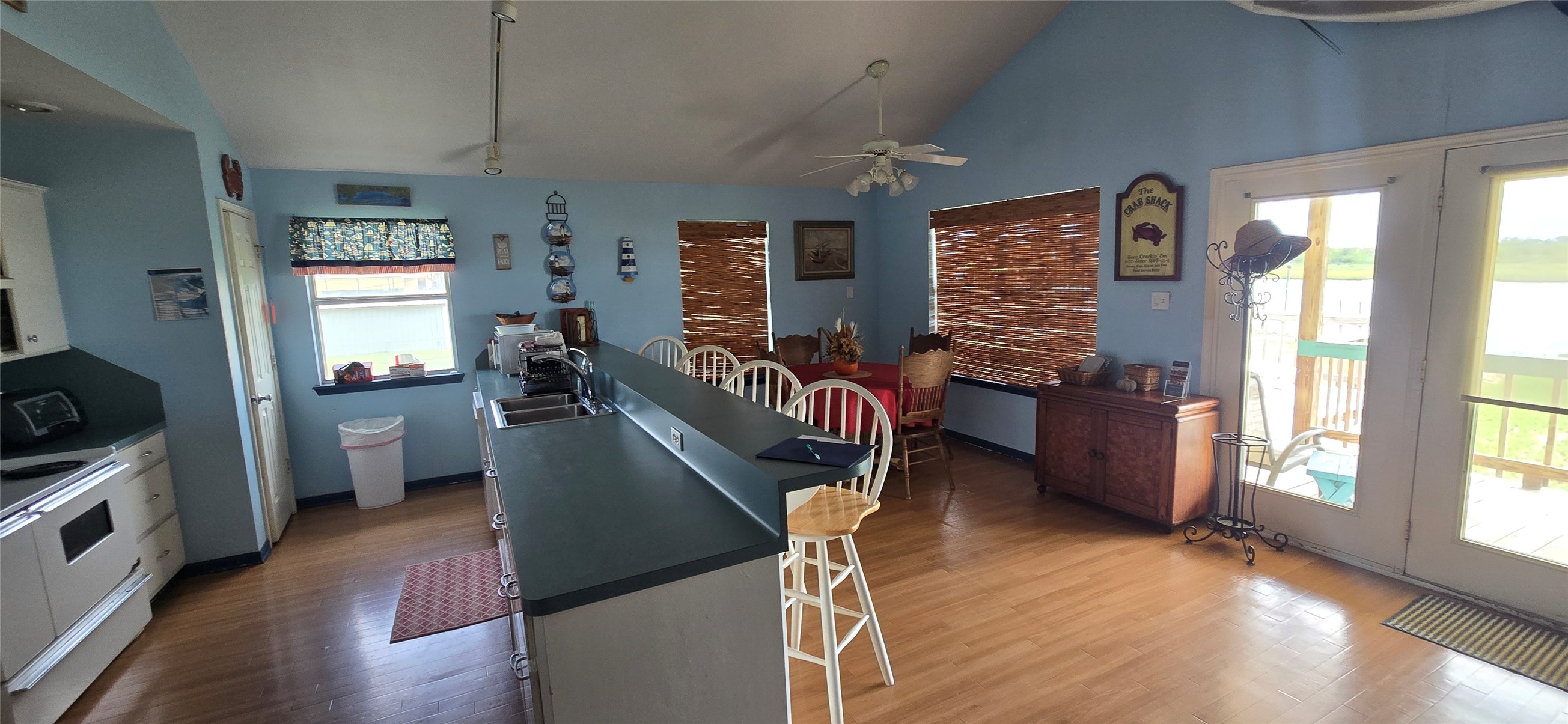 460 616th Sargent, TX 77414 - Photo 8 of 23 a view of a dining room with furniture window and wooden floor