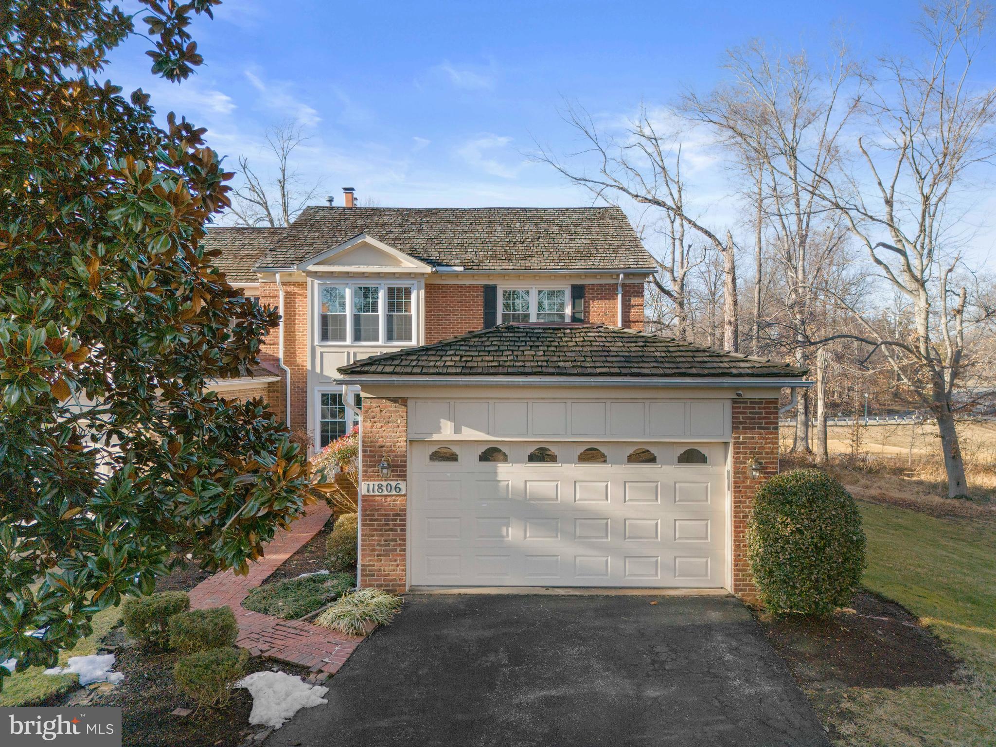 11806 Bishops Content Road Bowie, MD 20721 - Photo 1 of 49 a front view of a house with a yard and garage