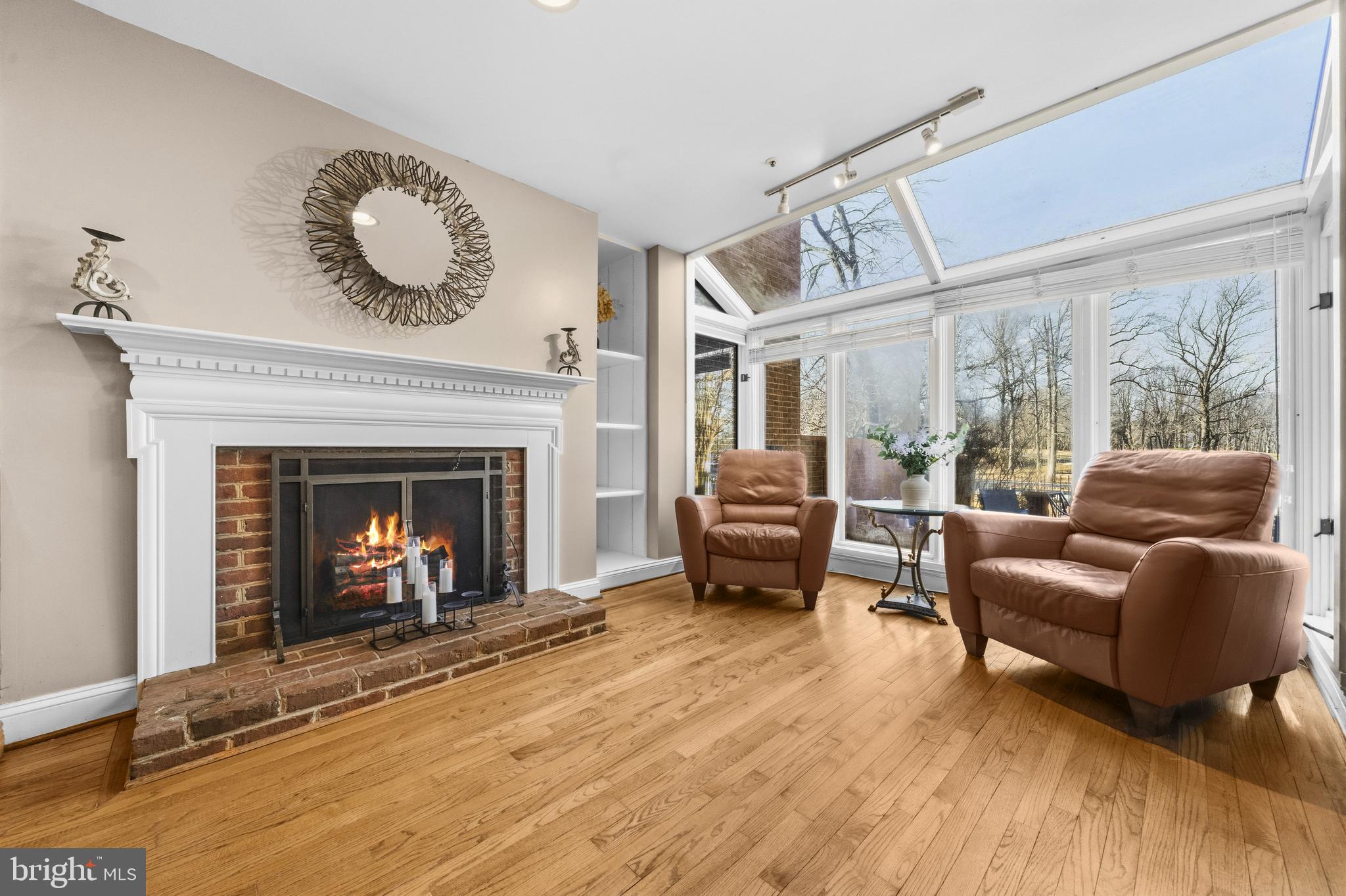 11806 Bishops Content Road Bowie, MD 20721 - Photo 11 of 49 a living room with furniture and a fireplace