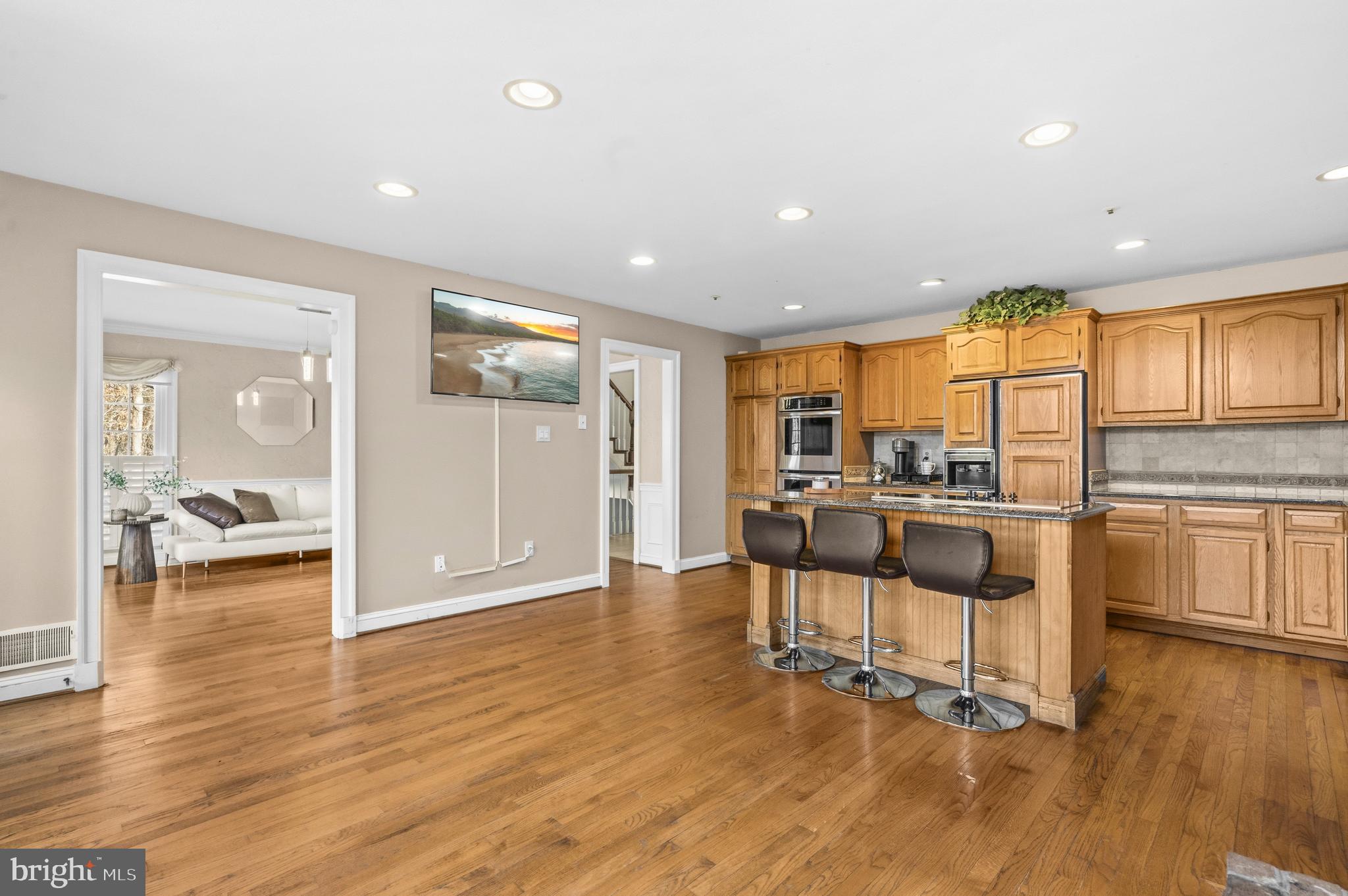 11806 Bishops Content Road Bowie, MD 20721 - Photo 12 of 49 a view of kitchen with furniture and wooden floor