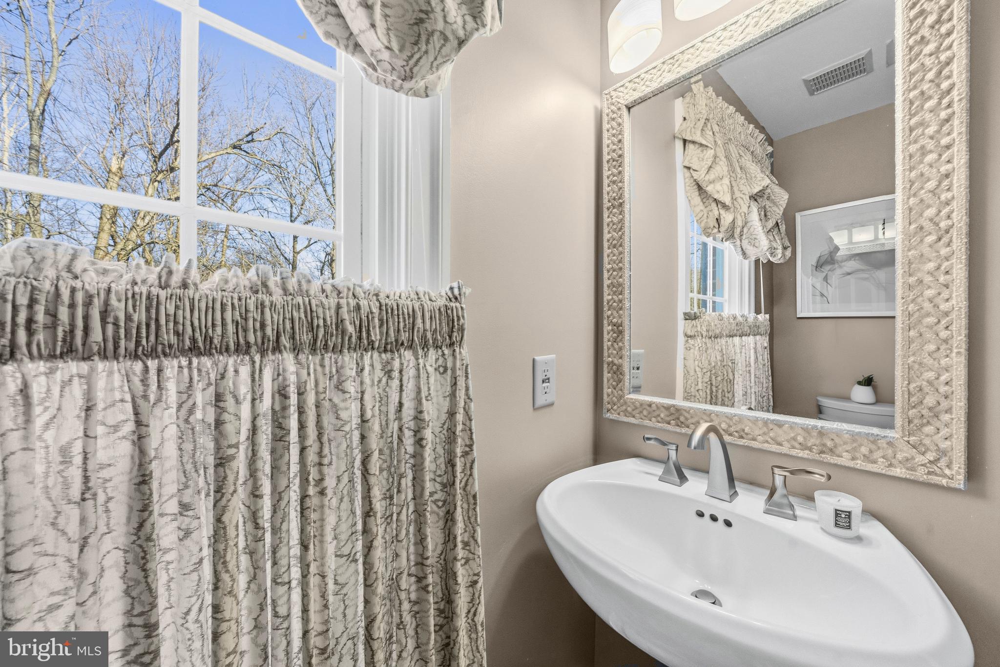 11806 Bishops Content Road Bowie, MD 20721 - Photo 15 of 49 a bathroom with a sink and a mirror