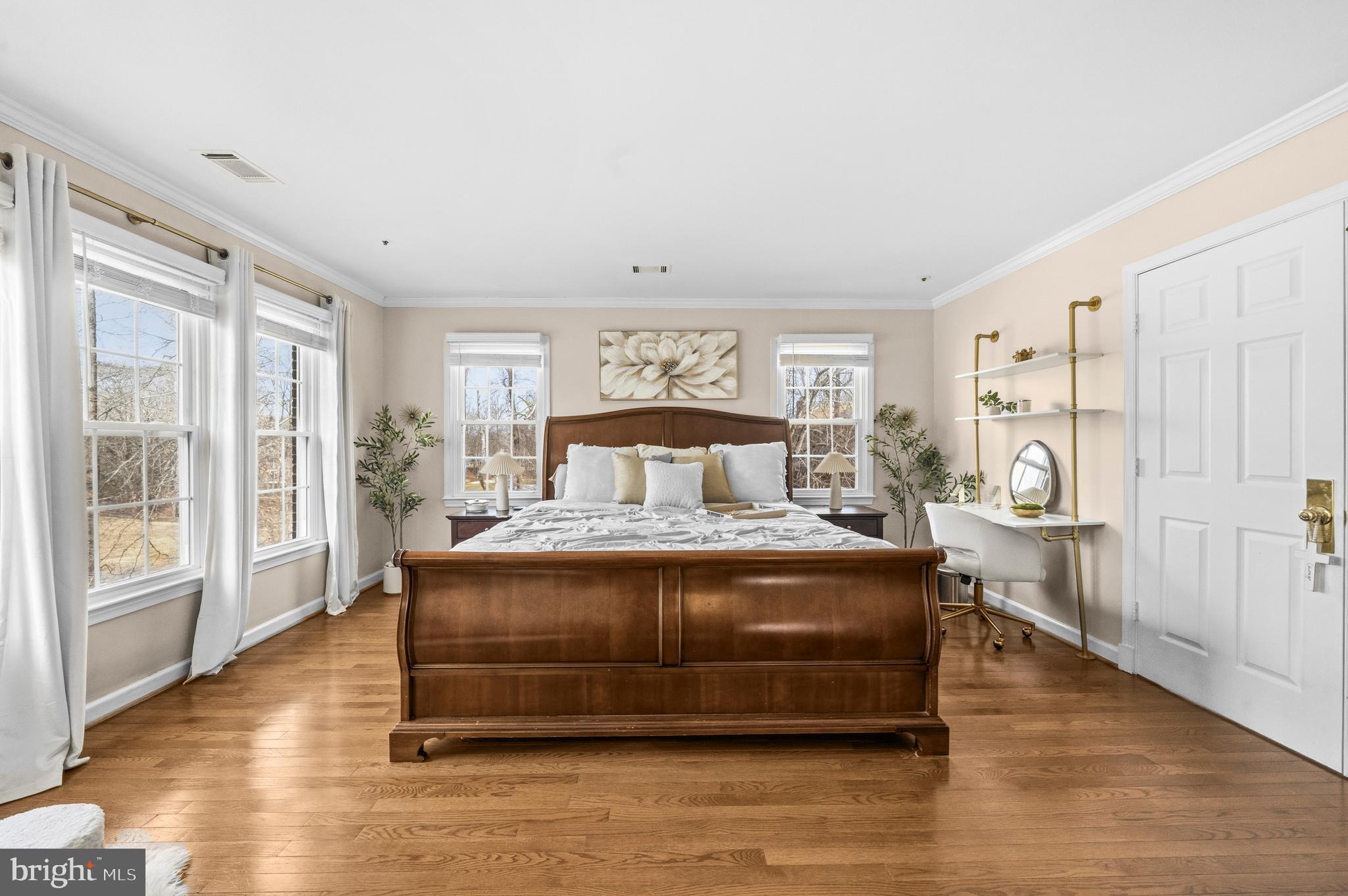 11806 Bishops Content Road Bowie, MD 20721 - Photo 16 of 49 a bedroom with a large bed and wooden floor