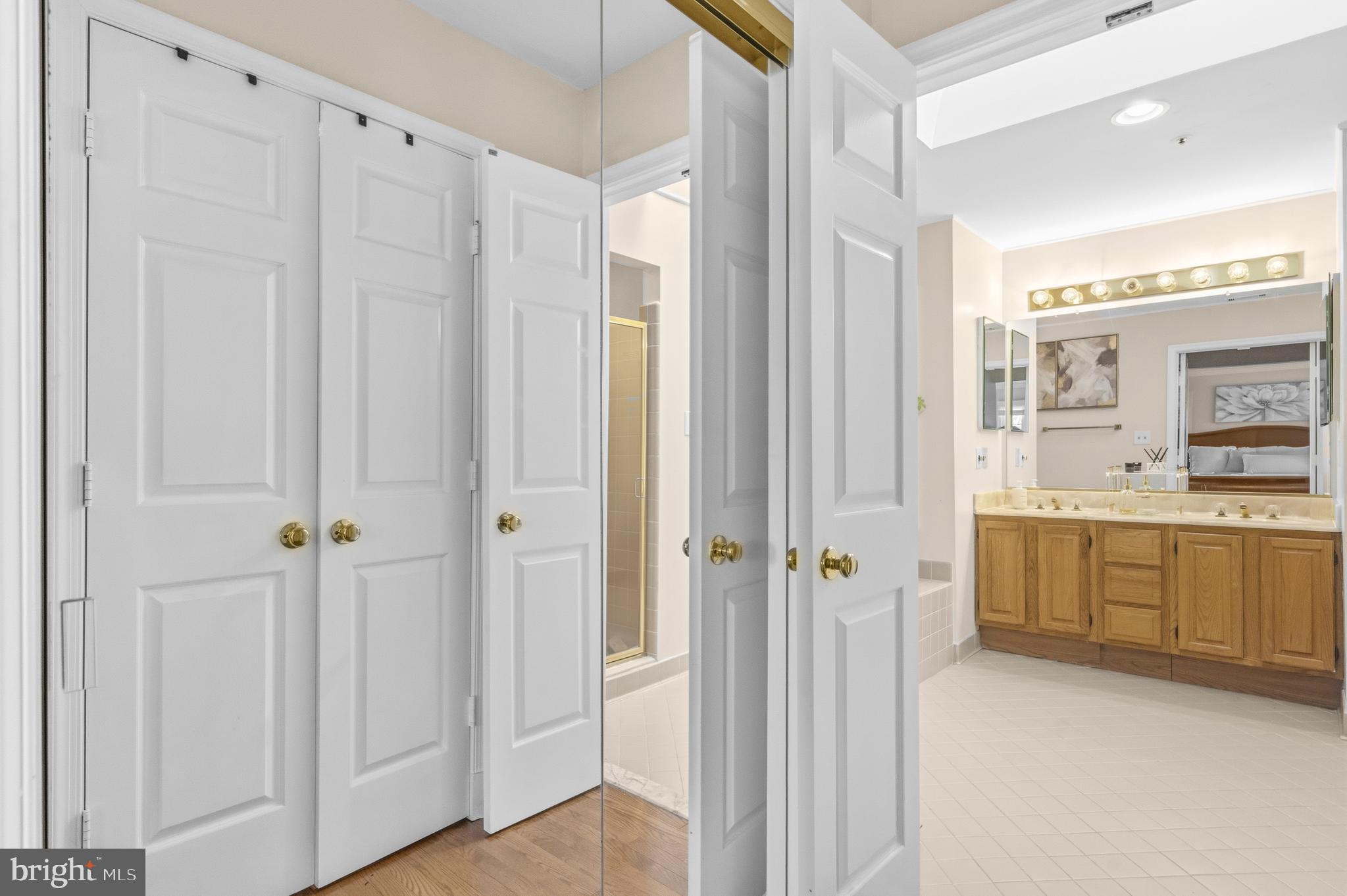 11806 Bishops Content Road Bowie, MD 20721 - Photo 22 of 49 a bathroom with a granite countertop sink mirror and a shower