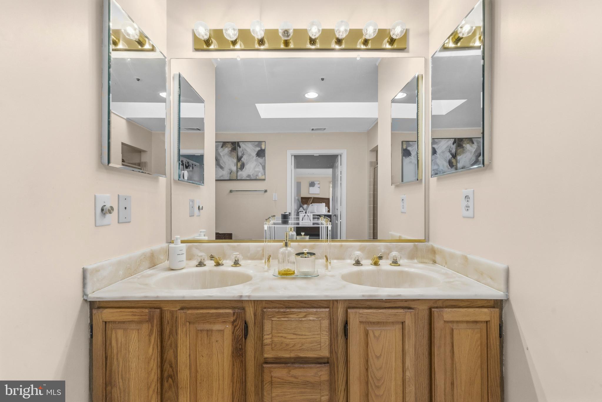11806 Bishops Content Road Bowie, MD 20721 - Photo 23 of 49 a bathroom with a sink and a mirror