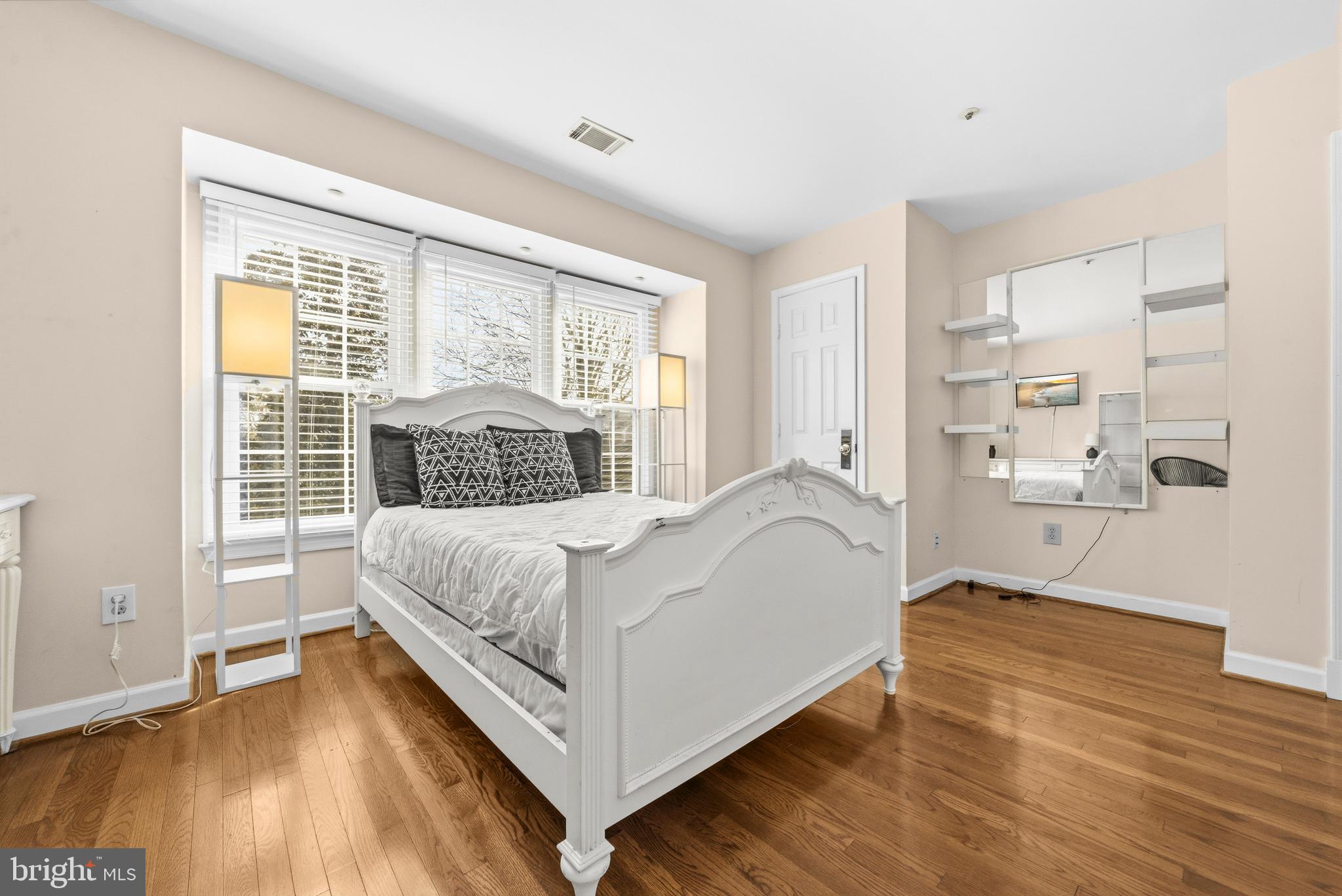 11806 Bishops Content Road Bowie, MD 20721 - Photo 27 of 49 a bedroom with a bed and a large window