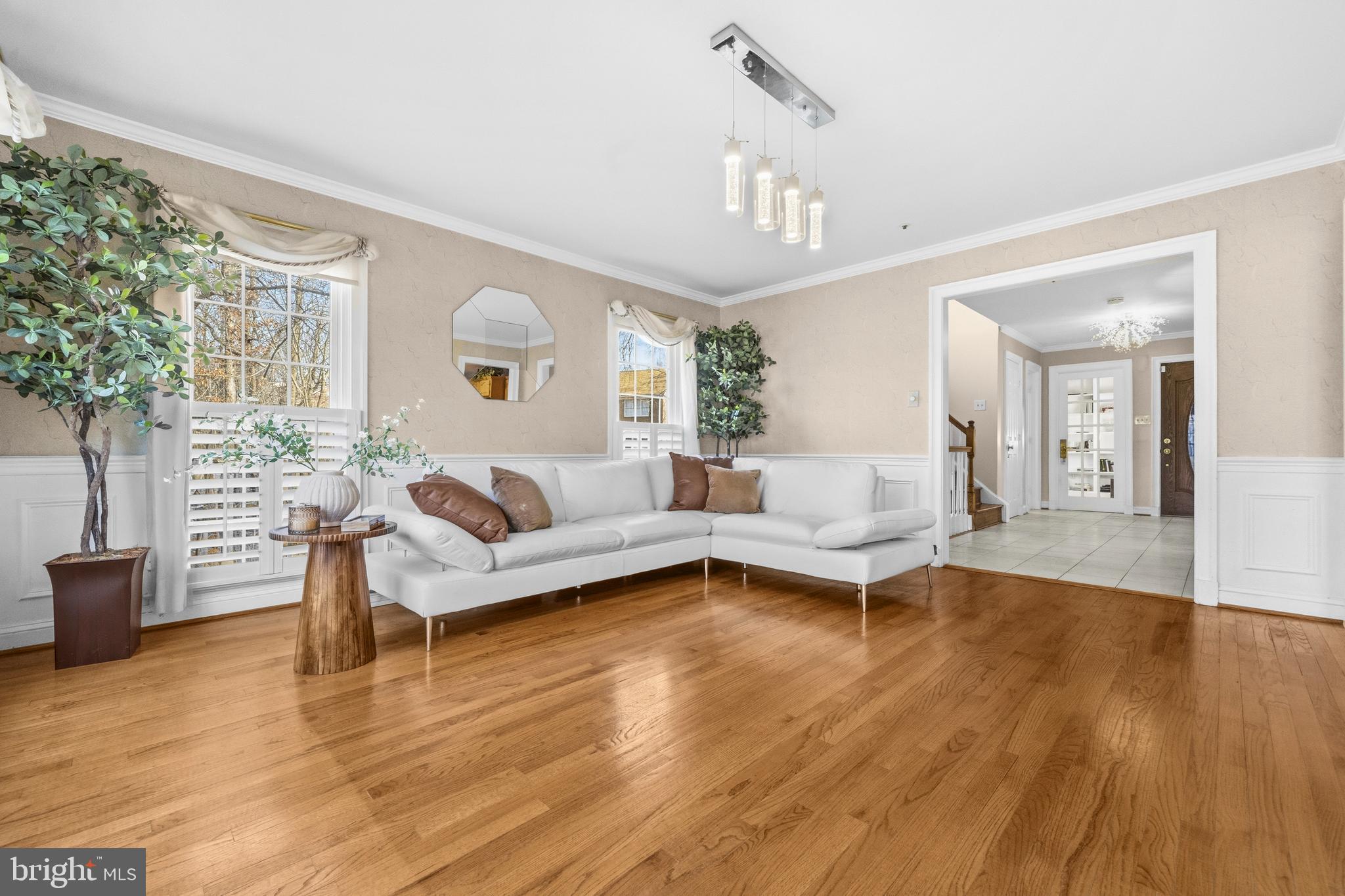 11806 Bishops Content Road Bowie, MD 20721 - Photo 3 of 49 a living room with furniture and a chandelier