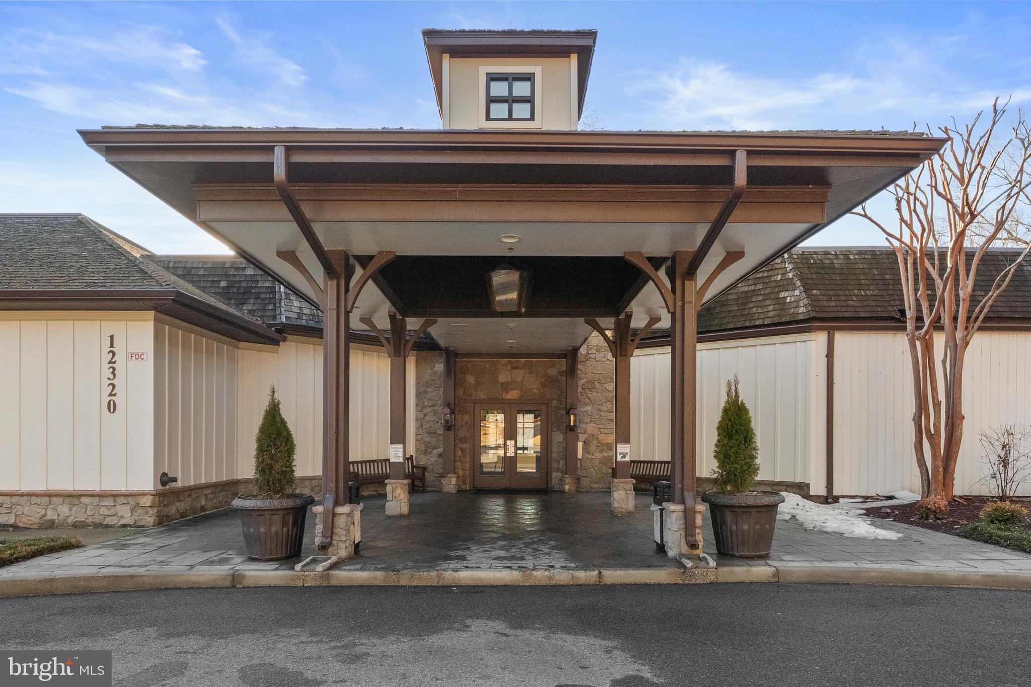 11806 Bishops Content Road Bowie, MD 20721 - Photo 44 of 49 a view of a porch with a table and chairs