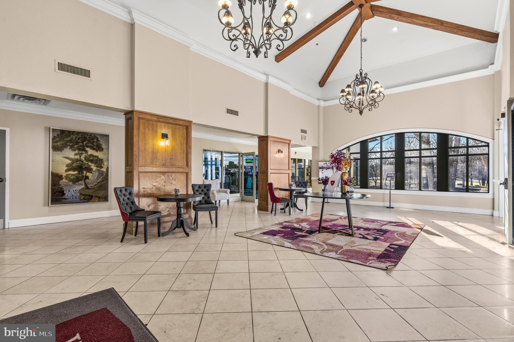 11806 Bishops Content Road Bowie, MD 20721 - Photo 45 of 49 a living room with furniture a chandelier and a rug