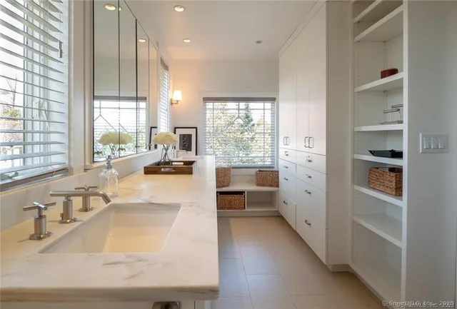 a backyard of a house with lots of green space and trees all around