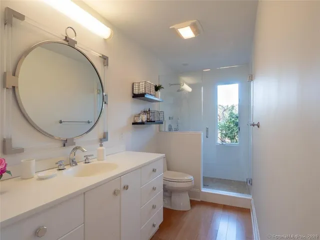 a view of a lake with a yard and furniture