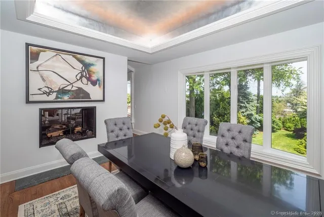 a large kitchen with kitchen island a large counter top space a sink stainless steel appliances and cabinets