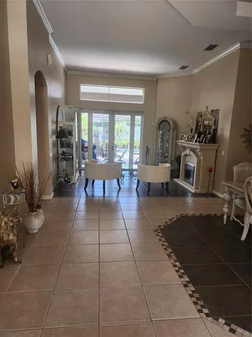 a living room with furniture a window and a fireplace