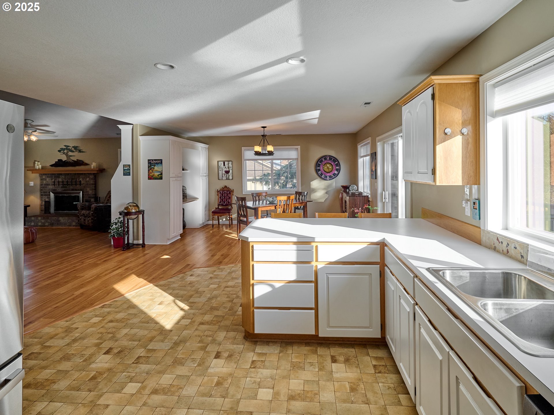 920 Hermanson Street Woodburn, OR 97071 - Photo 13 of 48 a kitchen with stainless steel appliances granite countertop a sink and cabinets