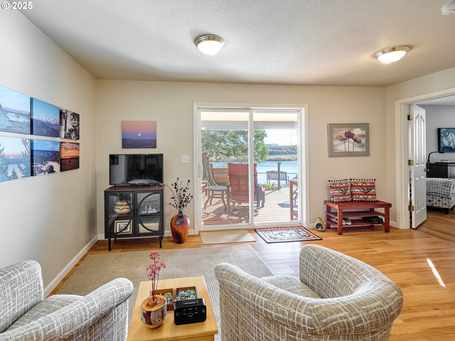 920 Hermanson Street Woodburn, OR 97071 - Photo 18 of 48 a living room with furniture and a flat screen tv