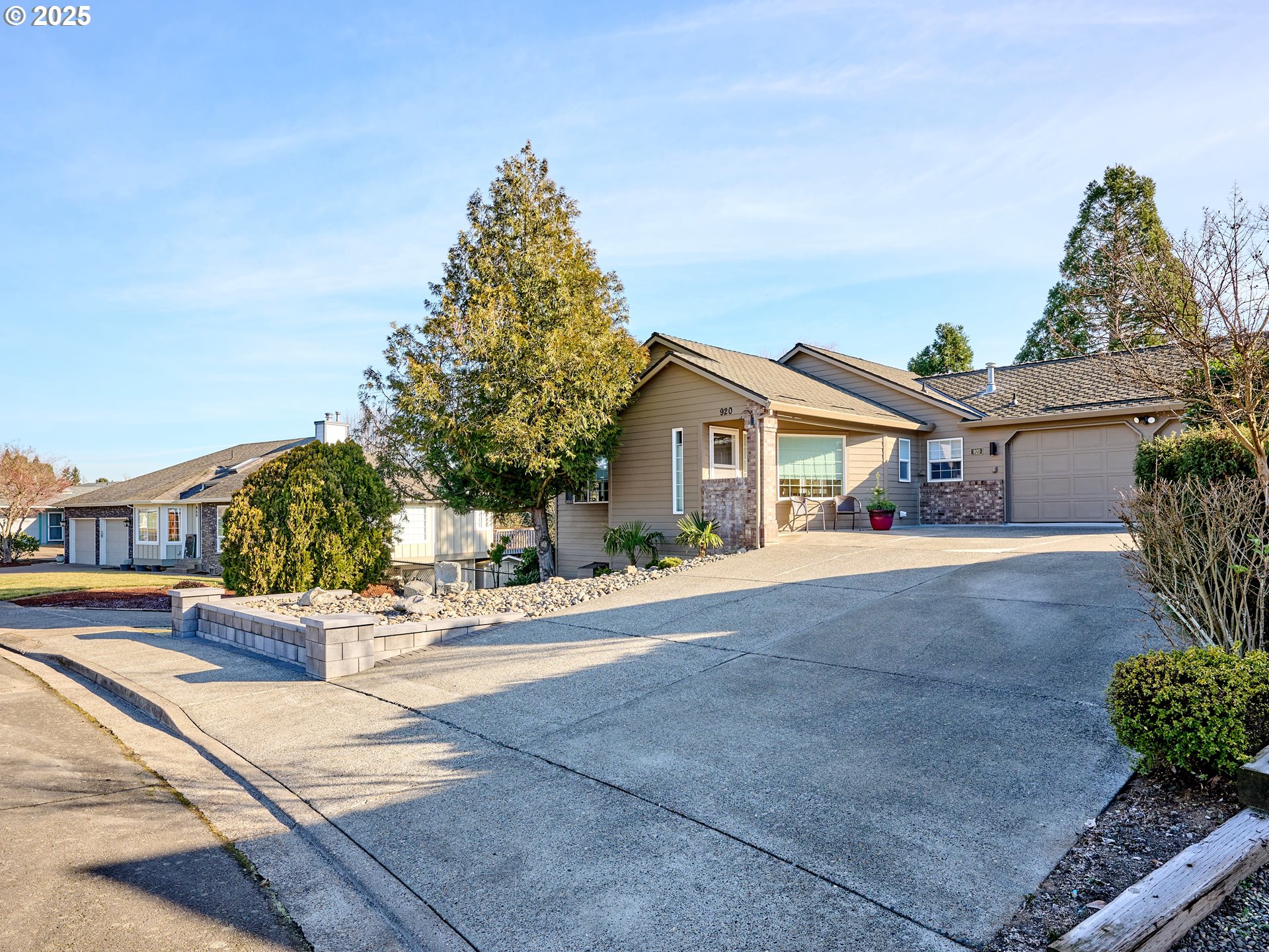 920 Hermanson Street Woodburn, OR 97071 - Photo 29 of 48 a front view of a house with a yard and potted plants