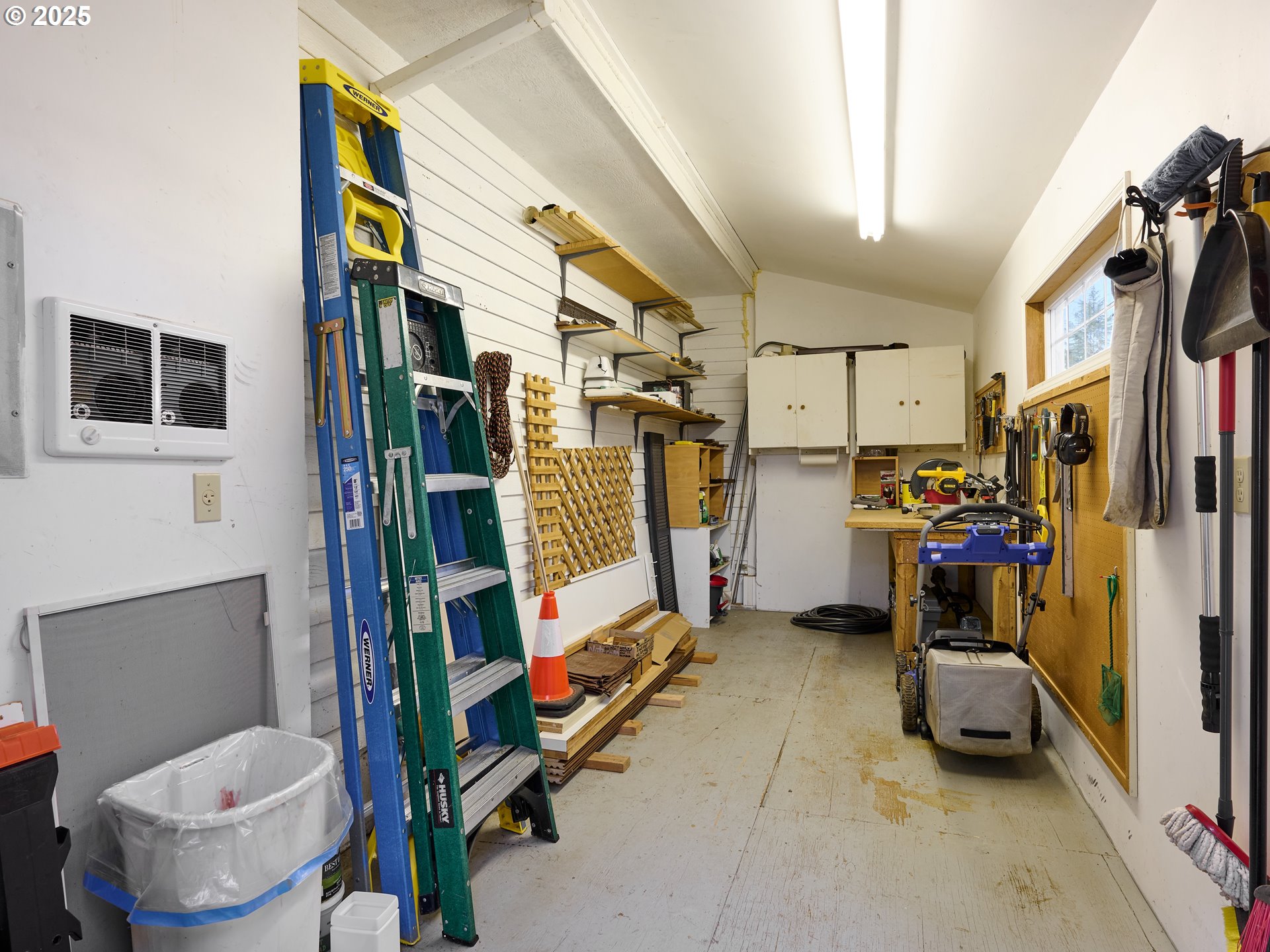 920 Hermanson Street Woodburn, OR 97071 - Photo 35 of 48 a storage room with water heater and refrigerator