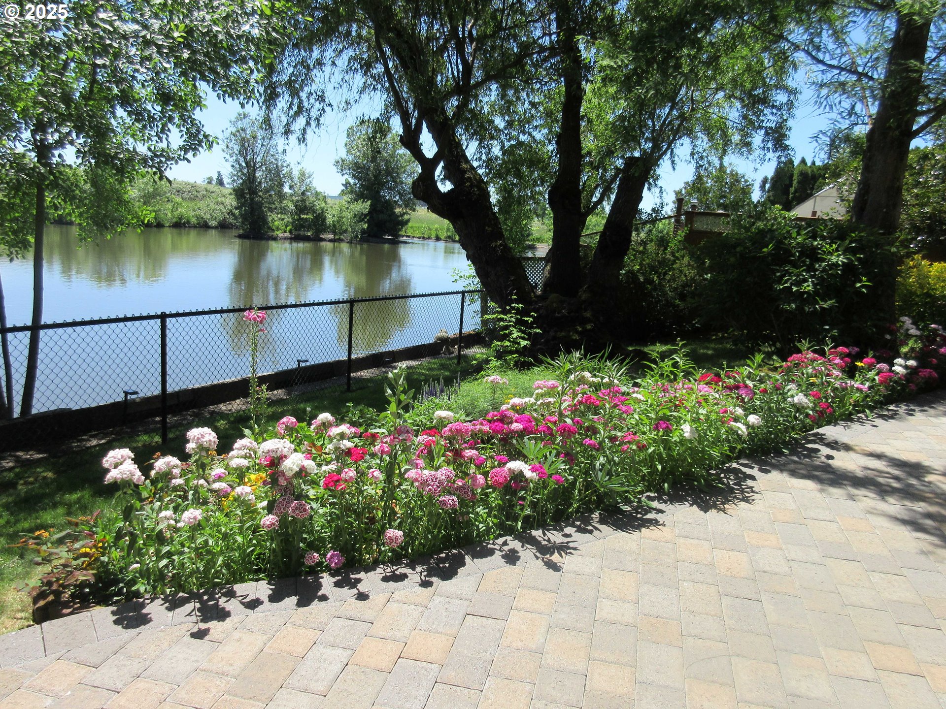 920 Hermanson Street Woodburn, OR 97071 - Photo 42 of 48 a view of a lake with a flower garden