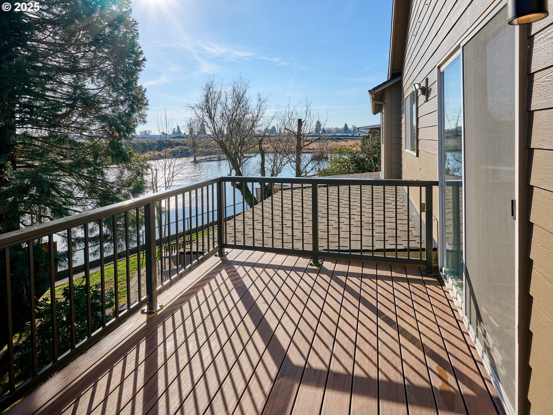 920 Hermanson Street Woodburn, OR 97071 - Photo 9 of 48 a view of balcony with wooden floor and fence