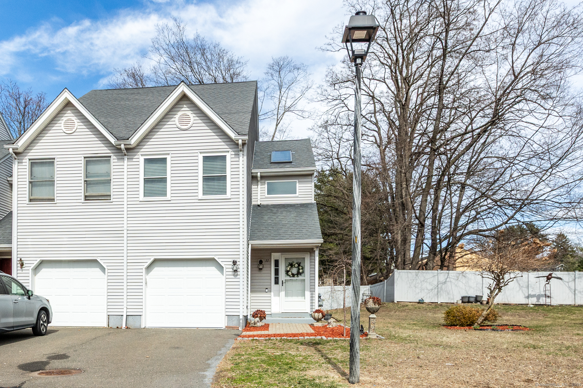 16 Maple Street, Unit 11 Vernon, CT 06066 - Photo 1 of 29 a front view of a house with garden