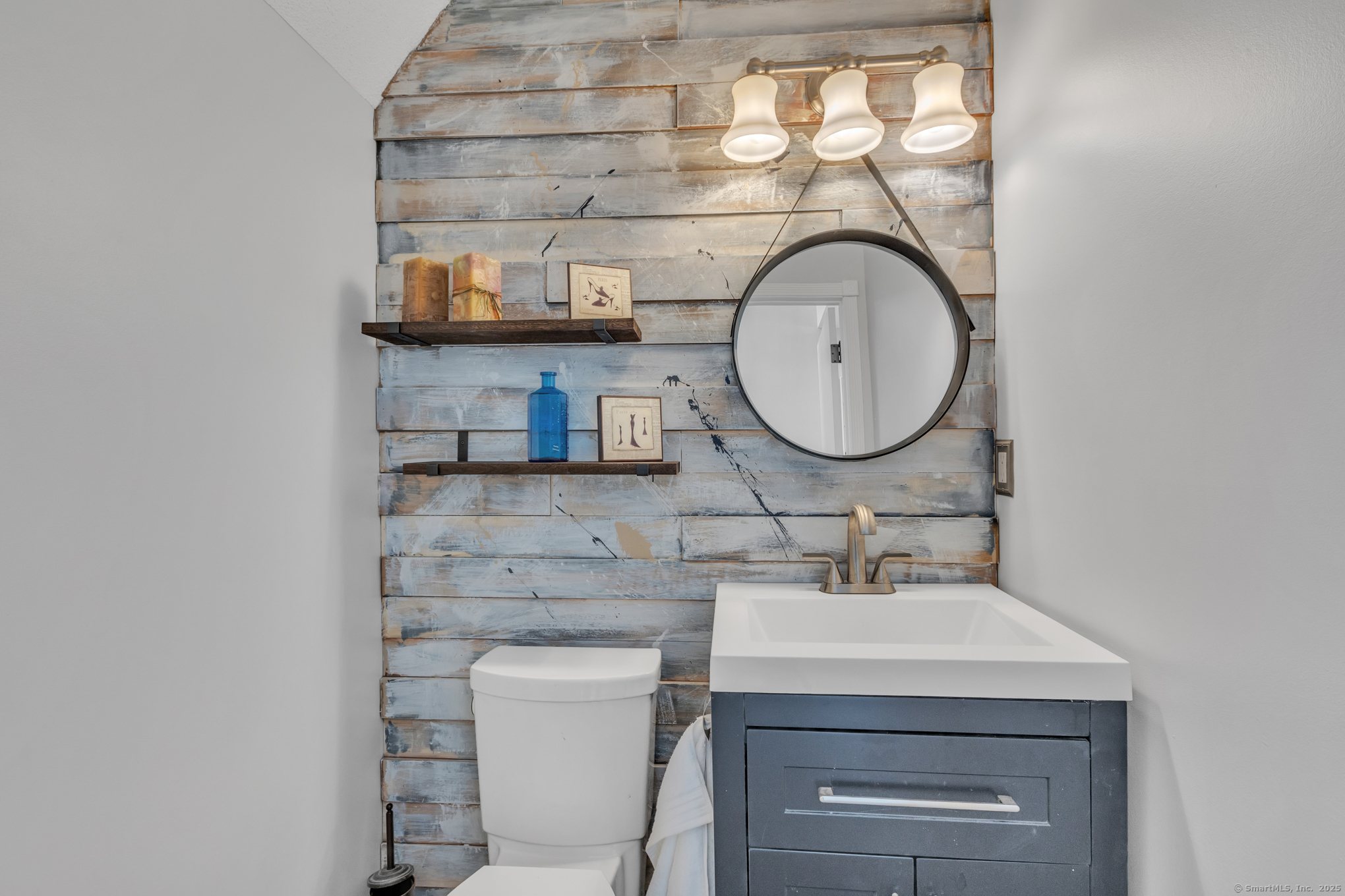 16 Maple Street, Unit 11 Vernon, CT 06066 - Photo 13 of 29 a bathroom with a sink mirror and vanity