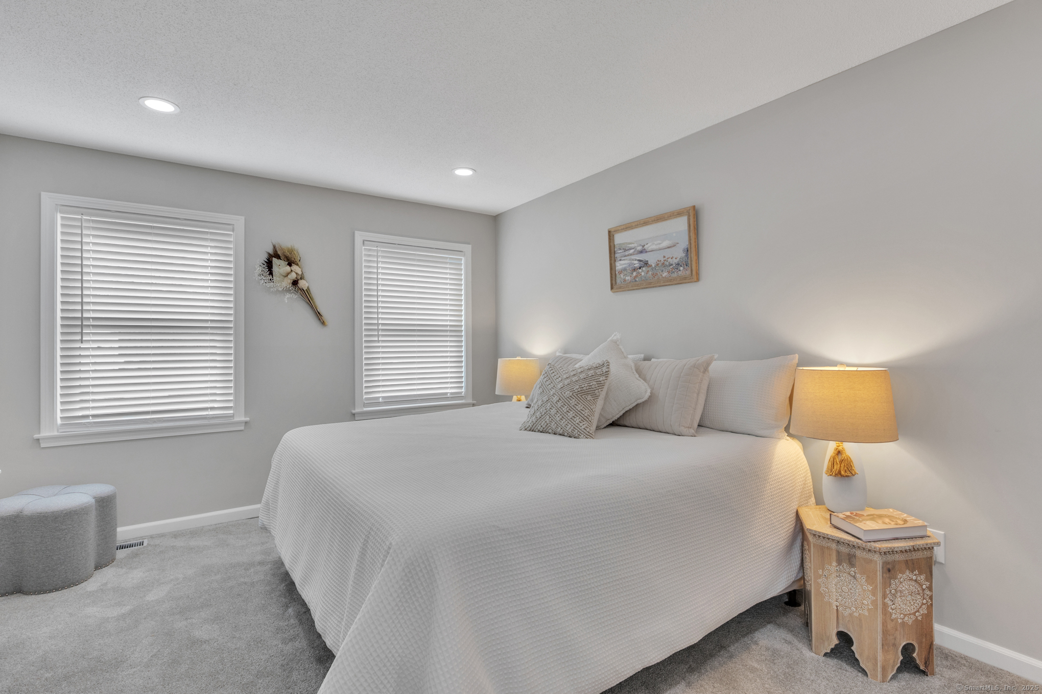 16 Maple Street, Unit 11 Vernon, CT 06066 - Photo 15 of 29 a bedroom with a bed and a lamp