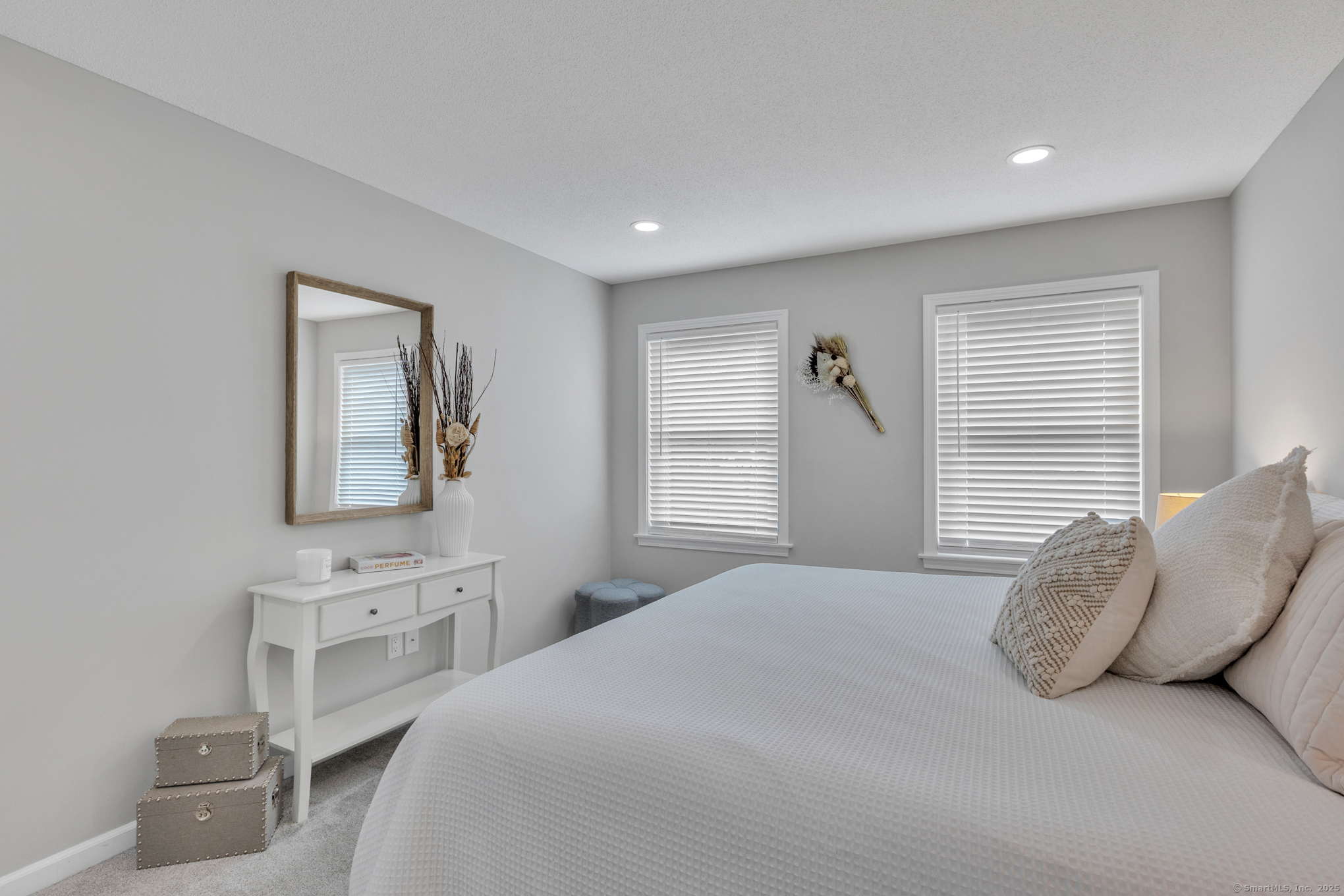 16 Maple Street, Unit 11 Vernon, CT 06066 - Photo 16 of 29 a spacious bedroom with a bed and a flat screen tv