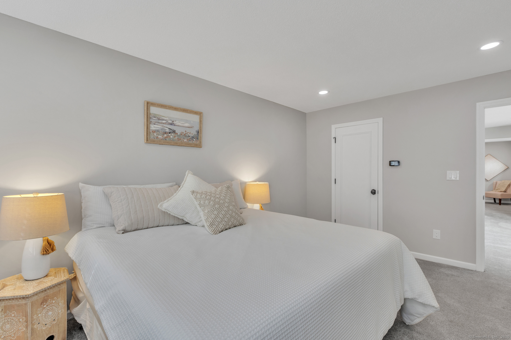 16 Maple Street, Unit 11 Vernon, CT 06066 - Photo 17 of 29 a bedroom with a bed and a lamp