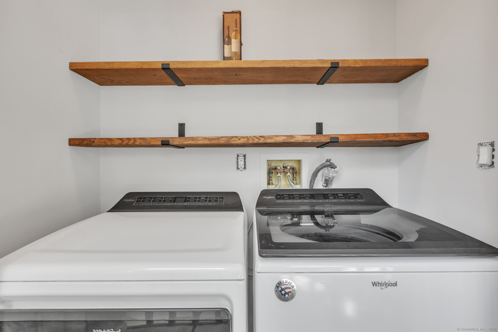 16 Maple Street, Unit 11 Vernon, CT 06066 - Photo 21 of 29 a close view of laundry room with a washer and dryer