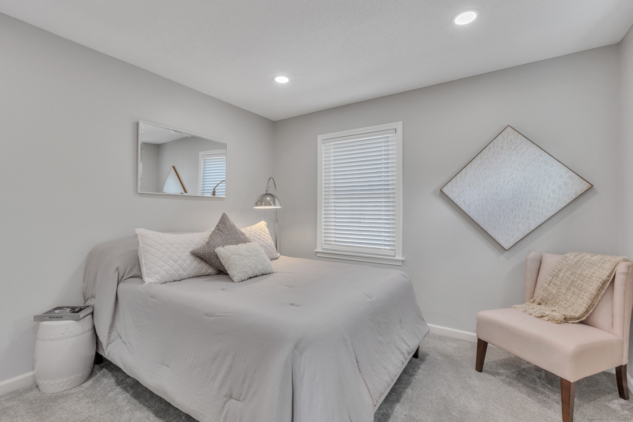 16 Maple Street, Unit 11 Vernon, CT 06066 - Photo 25 of 29 a bedroom with a bed and a couch