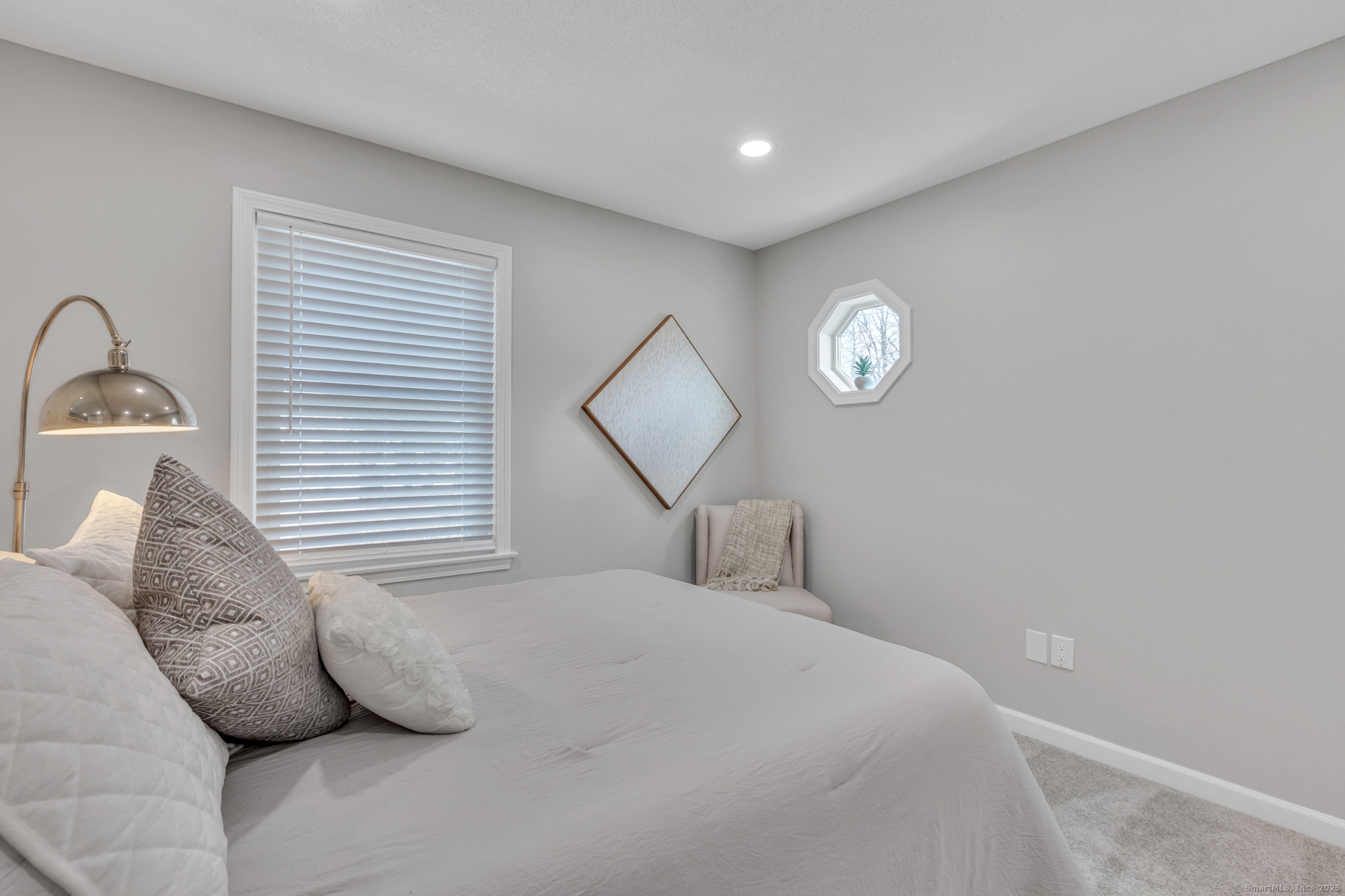 16 Maple Street, Unit 11 Vernon, CT 06066 - Photo 26 of 29 a bedroom with a bed and a window