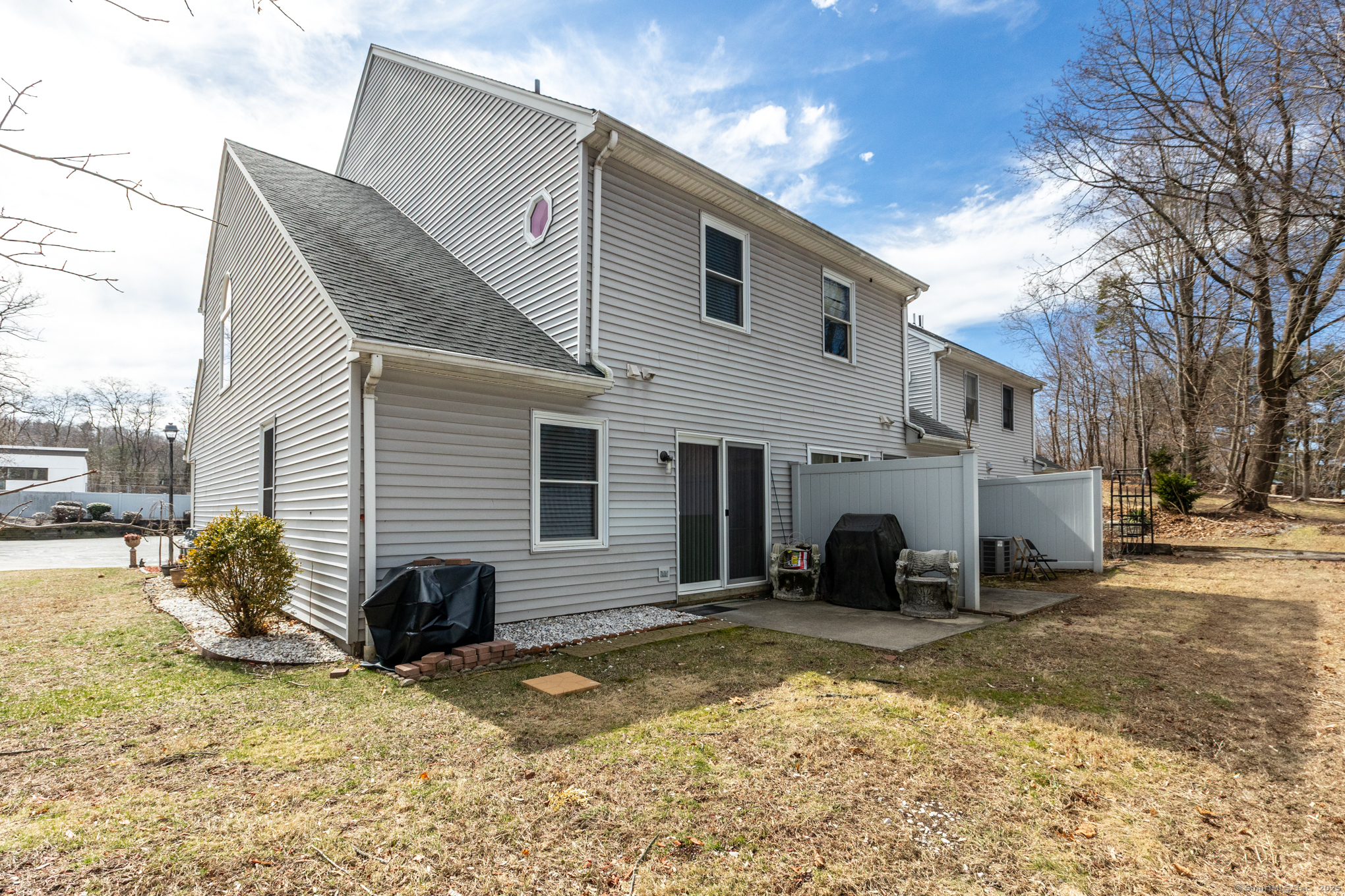 16 Maple Street, Unit 11 Vernon, CT 06066 - Photo 27 of 29 a view of a house with a yard covered in snow