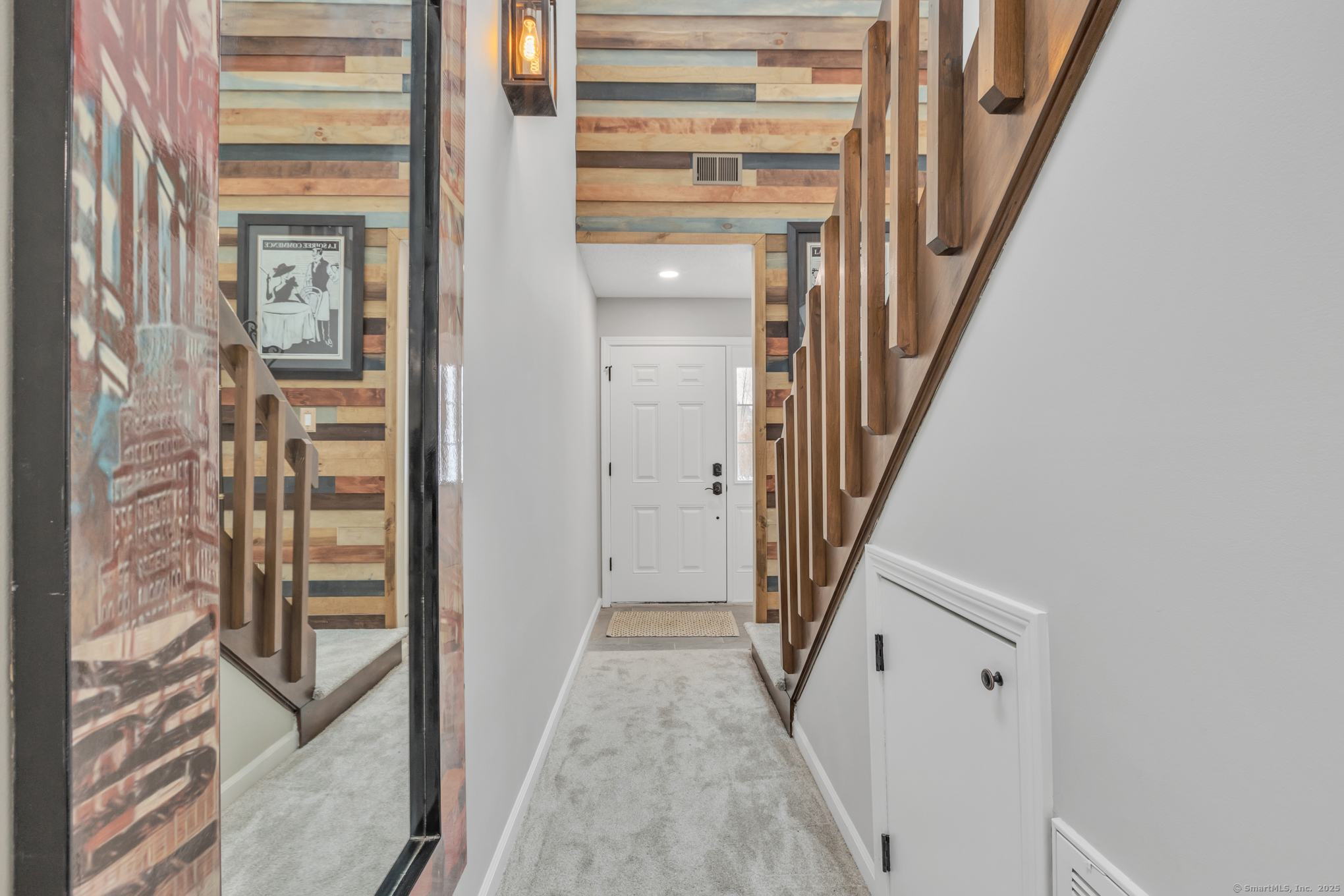 16 Maple Street, Unit 11 Vernon, CT 06066 - Photo 3 of 29 a view of a hallway with wooden floor and entryway