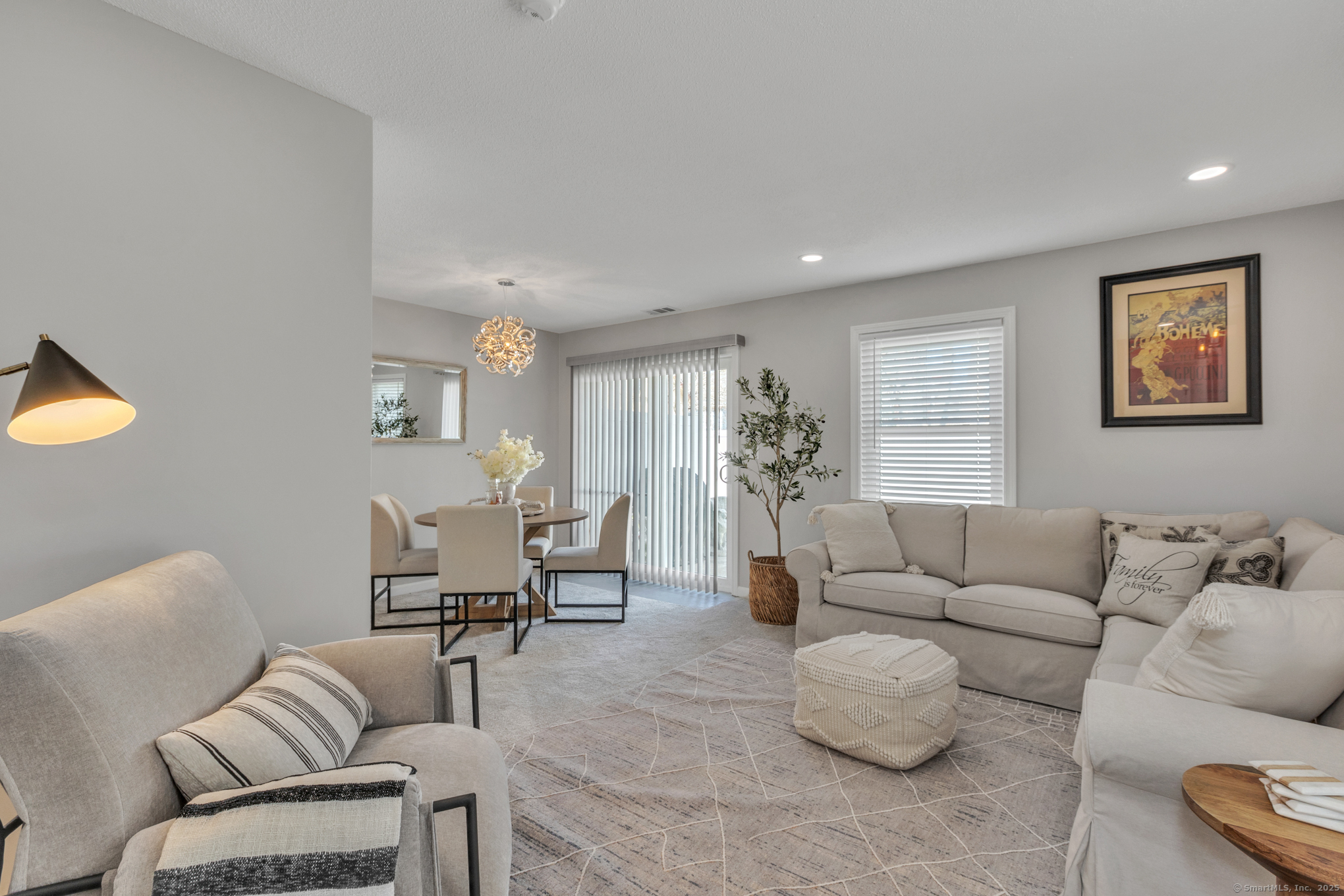 16 Maple Street, Unit 11 Vernon, CT 06066 - Photo 5 of 29 a living room with furniture and a large window