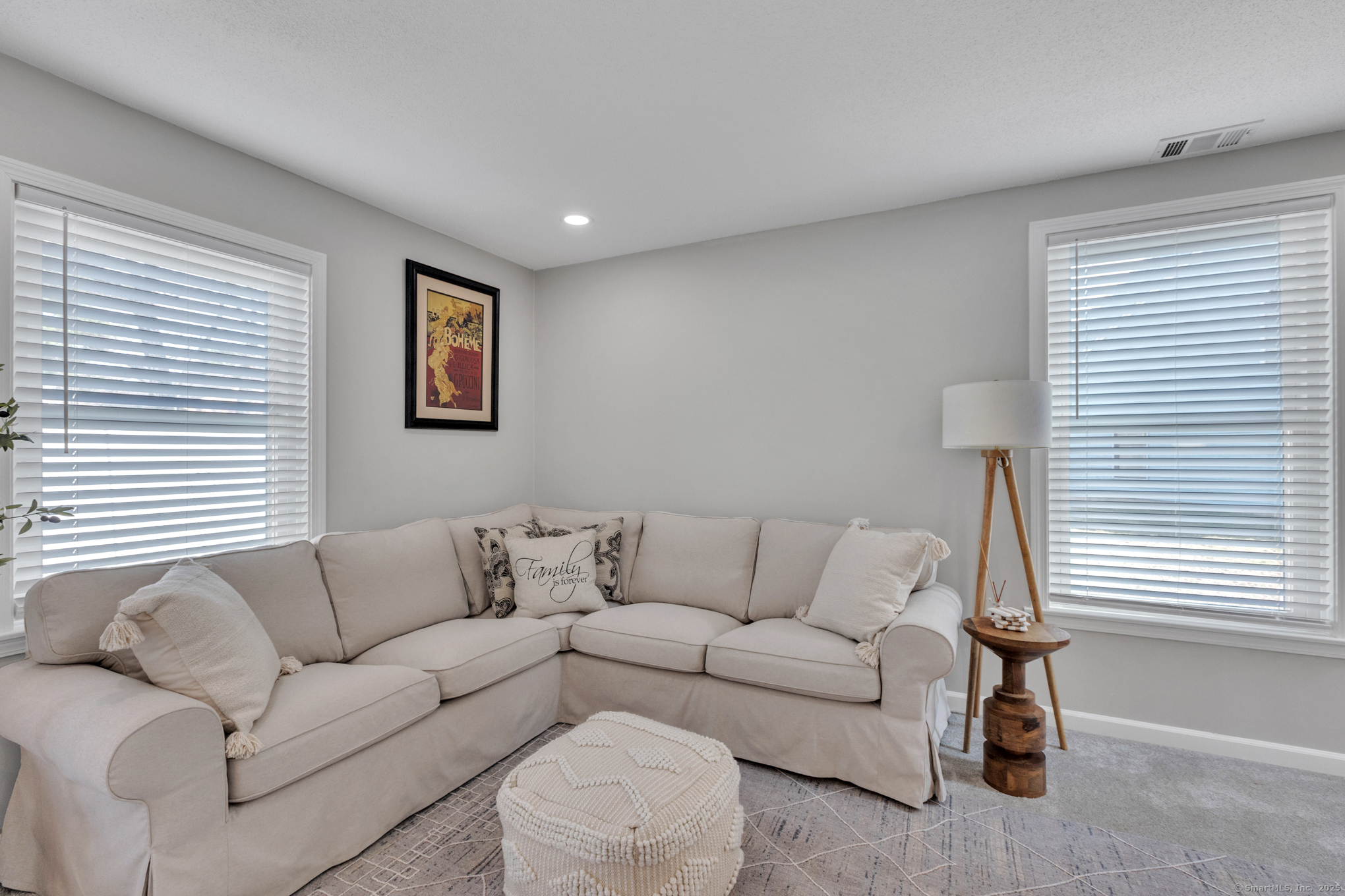 16 Maple Street, Unit 11 Vernon, CT 06066 - Photo 6 of 29 a living room with furniture and a large window