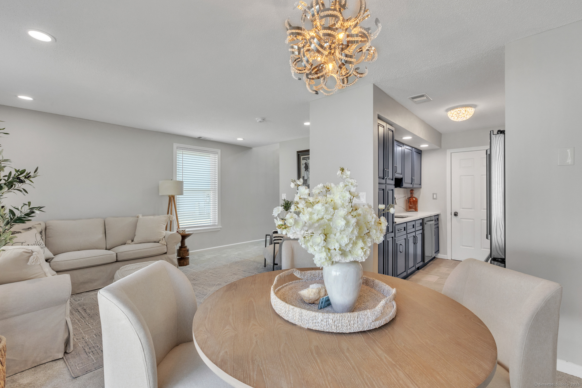 16 Maple Street, Unit 11 Vernon, CT 06066 - Photo 8 of 29 a living room with furniture and a table