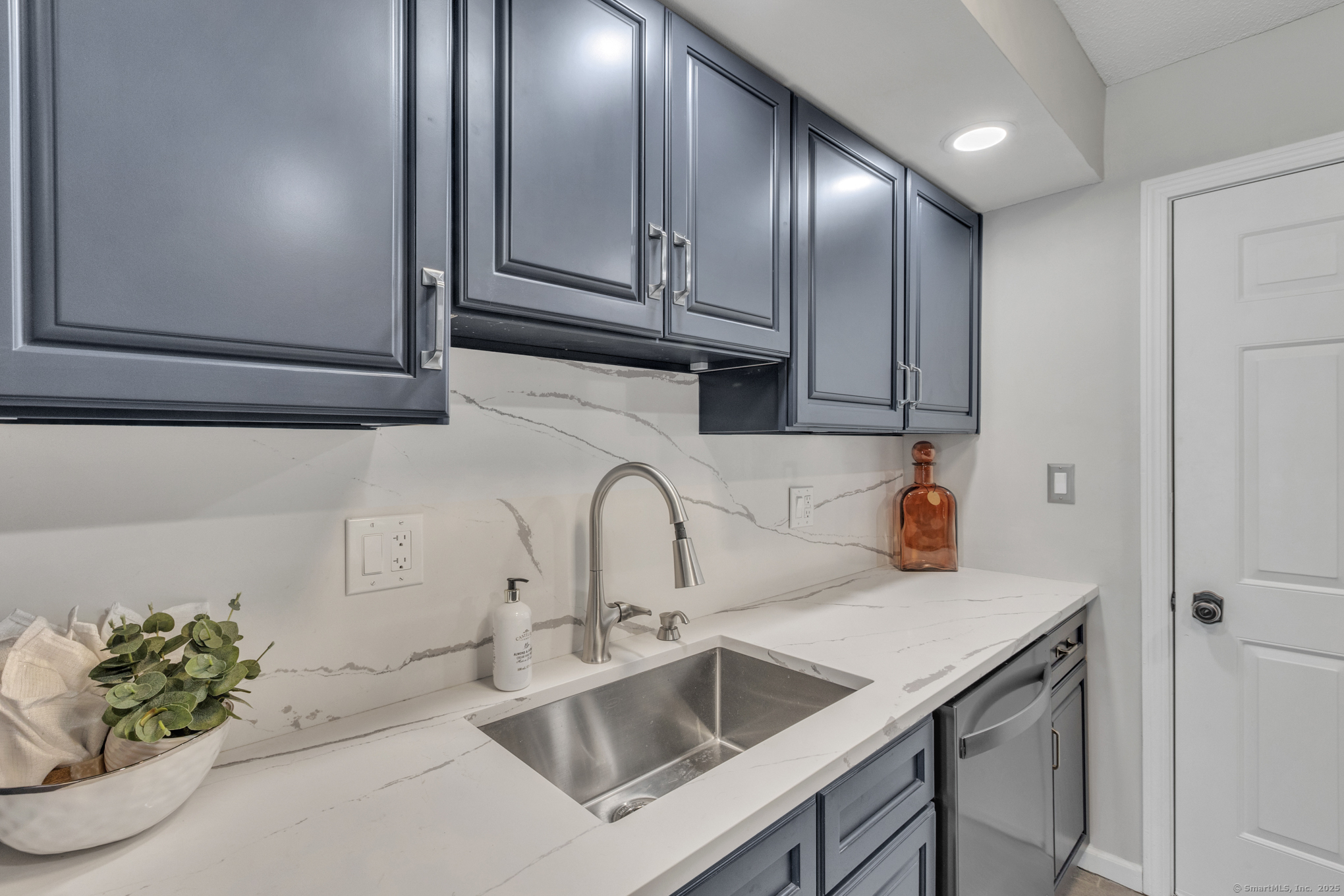 16 Maple Street, Unit 11 Vernon, CT 06066 - Photo 10 of 29 a kitchen with stainless steel appliances granite countertop a sink and cabinets