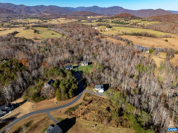 an aerial view of residential house and sandy dunes