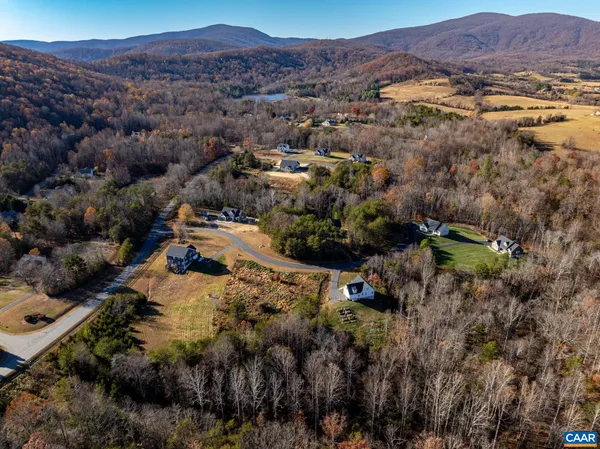 an aerial view of residential house and sandy dunes