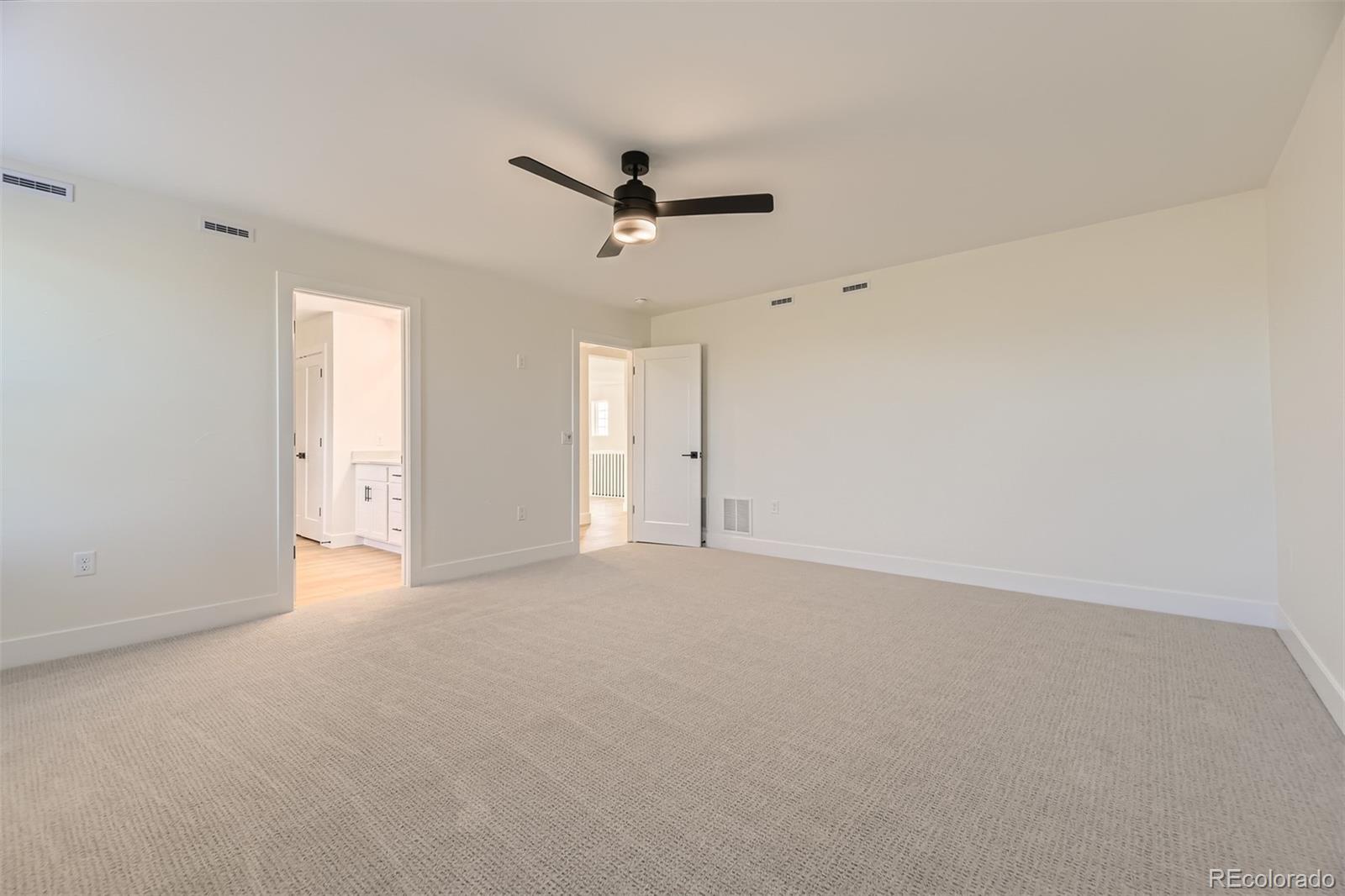 42984 Colonial Trail Elizabeth, CO 80107 - Photo 15 of 31 an empty room with a ceiling fan and a window
