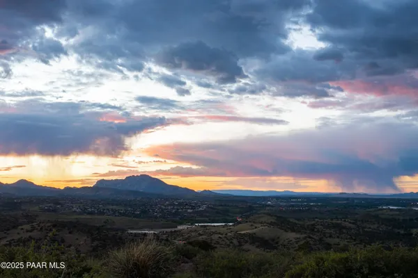 a view of sunset and city view
