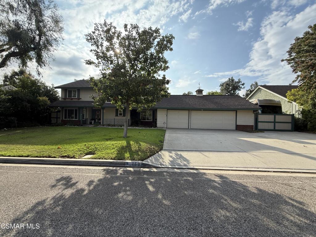a view of a house with a yard