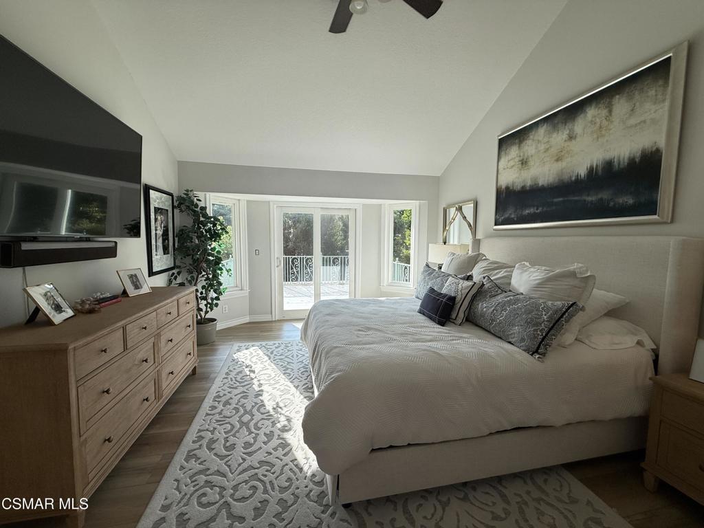 259 Sinaloa Road Simi Valley, CA 93065 - Photo 11 of 17 a bedroom with a large bed and a flat screen television