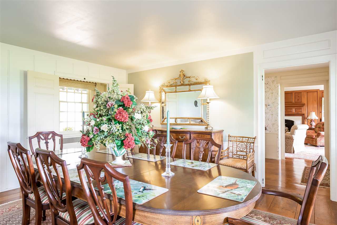 388 Rockfish Road Waynesboro, VA 22980 - Photo 12 of 50 a dining room with furniture a rug and wooden floor